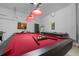 Pool table with cues and balls in game room at 256 Lancaster Dr, Davenport, FL 33897