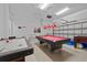 Fun game room with pool table and air hockey at 256 Lancaster Dr, Davenport, FL 33897