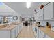 Bright kitchen featuring an island, breakfast nook, and lots of cabinet space at 256 Lancaster Dr, Davenport, FL 33897