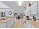 Bright kitchen with white cabinets and tile floor at 256 Lancaster Dr, Davenport, FL 33897