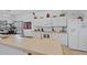 Spacious kitchen with white cabinets, ample counter space, and modern appliances at 256 Lancaster Dr, Davenport, FL 33897