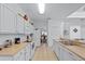 Open concept kitchen with white cabinets and a large island for extra seating at 256 Lancaster Dr, Davenport, FL 33897