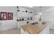 Modern kitchen with white cabinets, an island and breakfast bar at 256 Lancaster Dr, Davenport, FL 33897