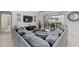 Gathering room with sectional sofa, large screen TV, and access to the patio at 256 Lancaster Dr, Davenport, FL 33897