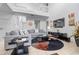Relaxing living room with sectional sofa, large TV, and high ceilings at 256 Lancaster Dr, Davenport, FL 33897
