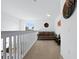 Bright loft area features a comfortable couch and window views at 256 Lancaster Dr, Davenport, FL 33897