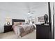 Spacious main bedroom with king-size bed and ceiling fan at 256 Lancaster Dr, Davenport, FL 33897