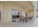 Covered patio with table and chairs at 256 Lancaster Dr, Davenport, FL 33897