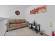 Cozy sitting area with a sofa and end table at 256 Lancaster Dr, Davenport, FL 33897