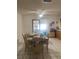 Bright dining room with table and chairs, view to kitchen at 2681 Robin Ave, Kissimmee, FL 34744