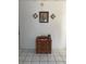 Entryway with antique wooden dresser and wall decor at 2681 Robin Ave, Kissimmee, FL 34744