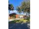 Brick house with a landscaped yard and driveway at 2681 Robin Ave, Kissimmee, FL 34744