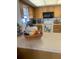 Kitchen features countertops, wood cabinets and black microwave at 2681 Robin Ave, Kissimmee, FL 34744