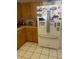 A kitchen with light countertops, wood cabinets, and a stainless steel refrigerator at 2681 Robin Ave, Kissimmee, FL 34744