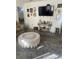 Living room featuring a large TV and comfy seating at 2681 Robin Ave, Kissimmee, FL 34744