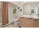 Bathroom featuring a shower/tub combo, oak vanity, and modern faucet at 2993 Stillwater Dr, Kissimmee, FL 34743