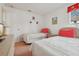 Twin bedroom featuring two beds, matching side tables, and dresser at 2993 Stillwater Dr, Kissimmee, FL 34743