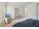 Bedroom featuring a comfortable bed, bureau, and a neutral color scheme at 2993 Stillwater Dr, Kissimmee, FL 34743