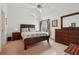 Spacious bedroom with a large window, ceiling fan, and natural light, providing a comfortable retreat at 2993 Stillwater Dr, Kissimmee, FL 34743