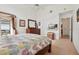 Well-lit bedroom with a large window, dresser with mirror, access to a patio and an en-suite bathroom at 2993 Stillwater Dr, Kissimmee, FL 34743