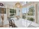 Inviting breakfast nook featuring a spacious table, window views, and decorative elements, creating a warm and welcoming space at 2993 Stillwater Dr, Kissimmee, FL 34743