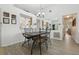 Inviting dining area featuring an ornate chandelier, decorative mirror, and charming details creating a warm, inviting space at 2993 Stillwater Dr, Kissimmee, FL 34743
