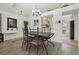 Cozy dining room features wood floors, an ornate chandelier and decor to add a charming touch to this inviting home at 2993 Stillwater Dr, Kissimmee, FL 34743