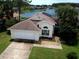 Charming home with a well-maintained lawn and a beautiful lake view in the backyard at 2993 Stillwater Dr, Kissimmee, FL 34743