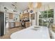 Well-lit kitchen and breakfast nook area featuring a large window, modern appliances, and ample counter space for cooking at 2993 Stillwater Dr, Kissimmee, FL 34743