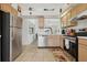 Updated kitchen with stainless steel refrigerator and view into the dining area at 2993 Stillwater Dr, Kissimmee, FL 34743