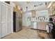 A view of the kitchen, featuring stainless steel appliances and bright white walls at 2993 Stillwater Dr, Kissimmee, FL 34743