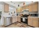 Classic kitchen features stainless steel appliances and bright, neutral countertops at 2993 Stillwater Dr, Kissimmee, FL 34743