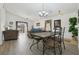 Open-concept living space with vaulted ceilings, wood-look floors, and natural light at 2993 Stillwater Dr, Kissimmee, FL 34743