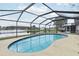 Beautiful enclosed pool offers scenic views of the adjacent lake, perfect for relaxation at 2993 Stillwater Dr, Kissimmee, FL 34743