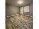 Spacious bedroom with wood-look tile floors at 3036 Parkway Blvd # 104, Kissimmee, FL 34747