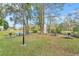 Relaxing community area with pond, fountain, picnic tables at 3036 Parkway Blvd # 104, Kissimmee, FL 34747