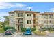 Two-story condo building with ample parking and landscaping at 3036 Parkway Blvd # 104, Kissimmee, FL 34747