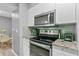 Stainless steel appliances and granite countertops in kitchen at 3036 Parkway Blvd # 104, Kissimmee, FL 34747