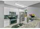 Modern kitchen with stainless steel appliances and granite counters at 3036 Parkway Blvd # 104, Kissimmee, FL 34747