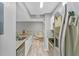 Open concept kitchen with island and stainless steel appliances at 3036 Parkway Blvd # 104, Kissimmee, FL 34747