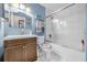 Bathroom with blue walls, butterfly themed decor, and white tiled shower at 306 Boger N Blvd, Lakeland, FL 33803