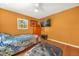 Spacious bedroom with hardwood floors and a flat-screen TV at 306 Boger N Blvd, Lakeland, FL 33803