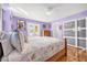 Bedroom with wood floors, a log bed frame, and access to a private deck at 306 Boger N Blvd, Lakeland, FL 33803