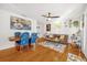 Bright dining room features hardwood floors and a wooden table with blue patterned chairs at 306 Boger N Blvd, Lakeland, FL 33803