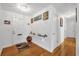 Inviting entryway with hardwood floors, white walls, and decorative shelving at 306 Boger N Blvd, Lakeland, FL 33803