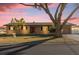 Brick ranch house with a large tree and attached garage at 306 Boger N Blvd, Lakeland, FL 33803