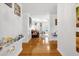 Bright hallway with hardwood floors, leading to living areas at 306 Boger N Blvd, Lakeland, FL 33803