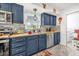 Updated kitchen with butcher block countertops and blue cabinets at 306 Boger N Blvd, Lakeland, FL 33803