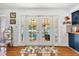 View of the backyard pool through the kitchen's French doors at 306 Boger N Blvd, Lakeland, FL 33803