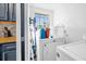 Laundry room with washer, dryer, and storage at 306 Boger N Blvd, Lakeland, FL 33803